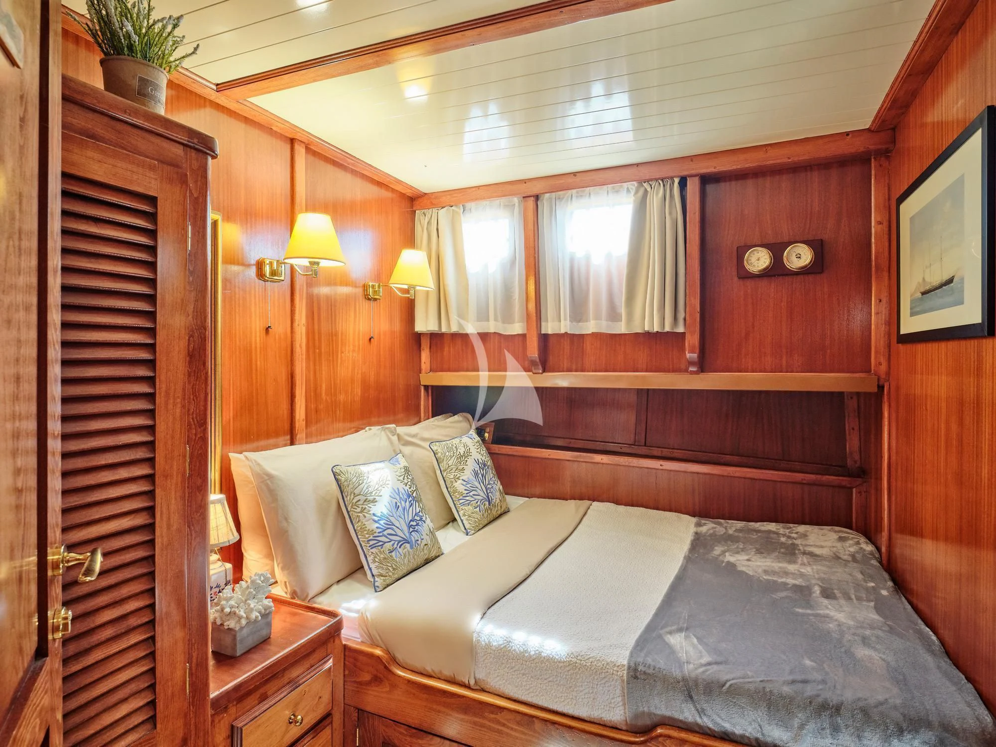 a bed in a room aboard MYRA Yacht for Sale