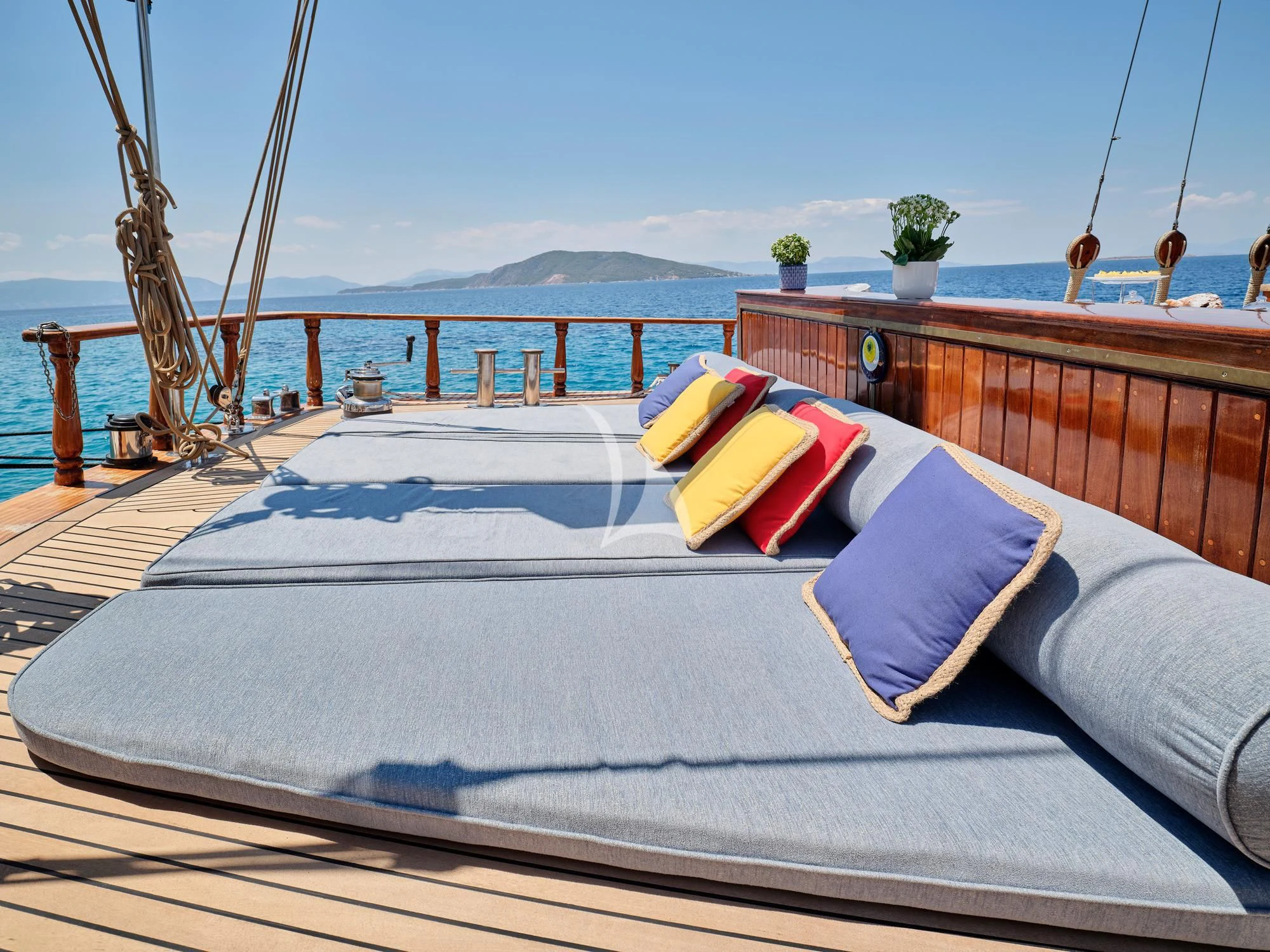 a bed on a balcony aboard MYRA Yacht for Sale