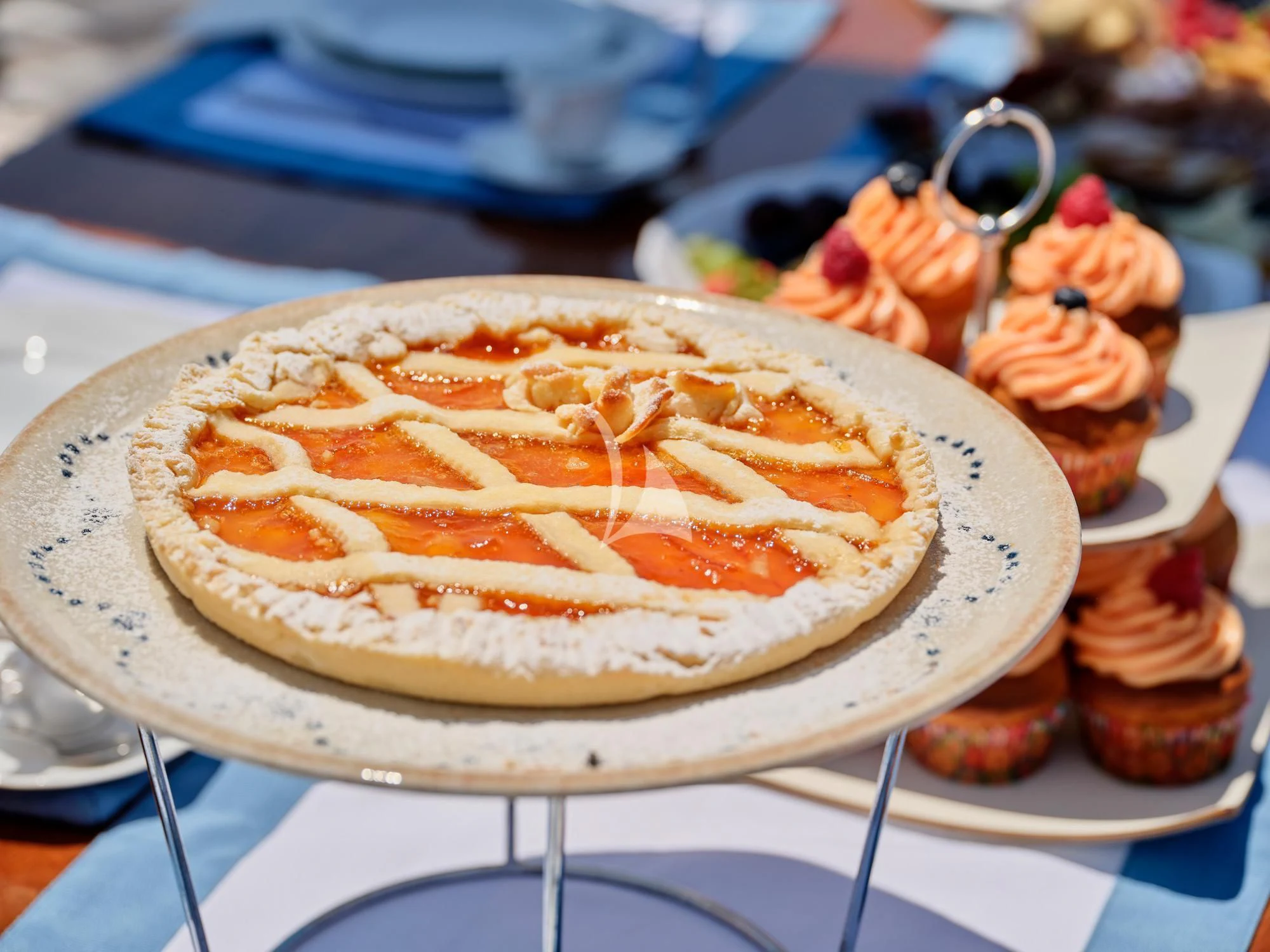 a cake with fruit on top aboard MYRA Yacht for Sale