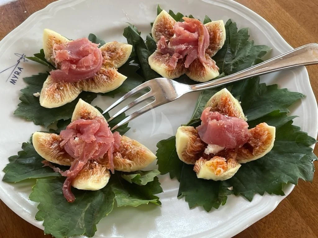 a plate of food aboard MYRA Yacht for Sale