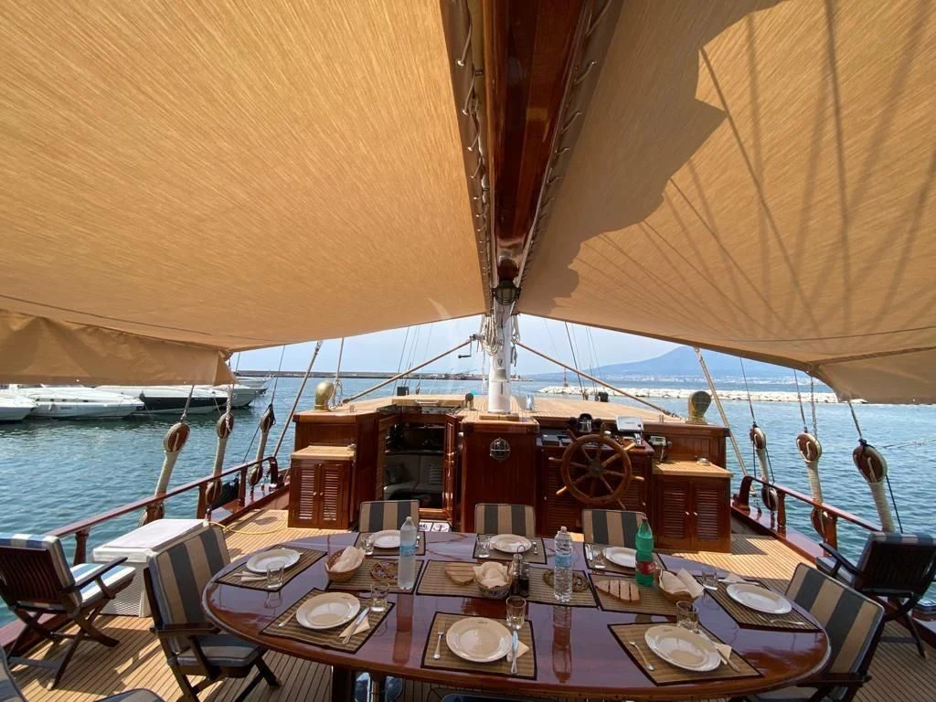 a dining table on a boat aboard MYRA Yacht for Sale