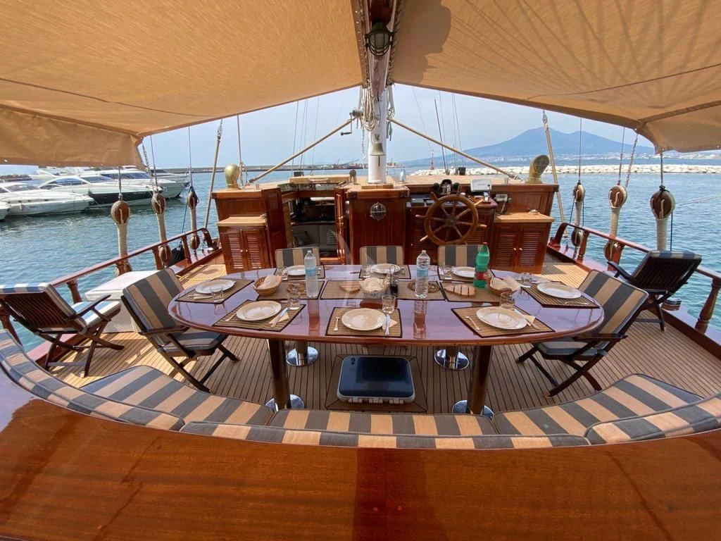 a table set for a meal aboard MYRA Yacht for Sale