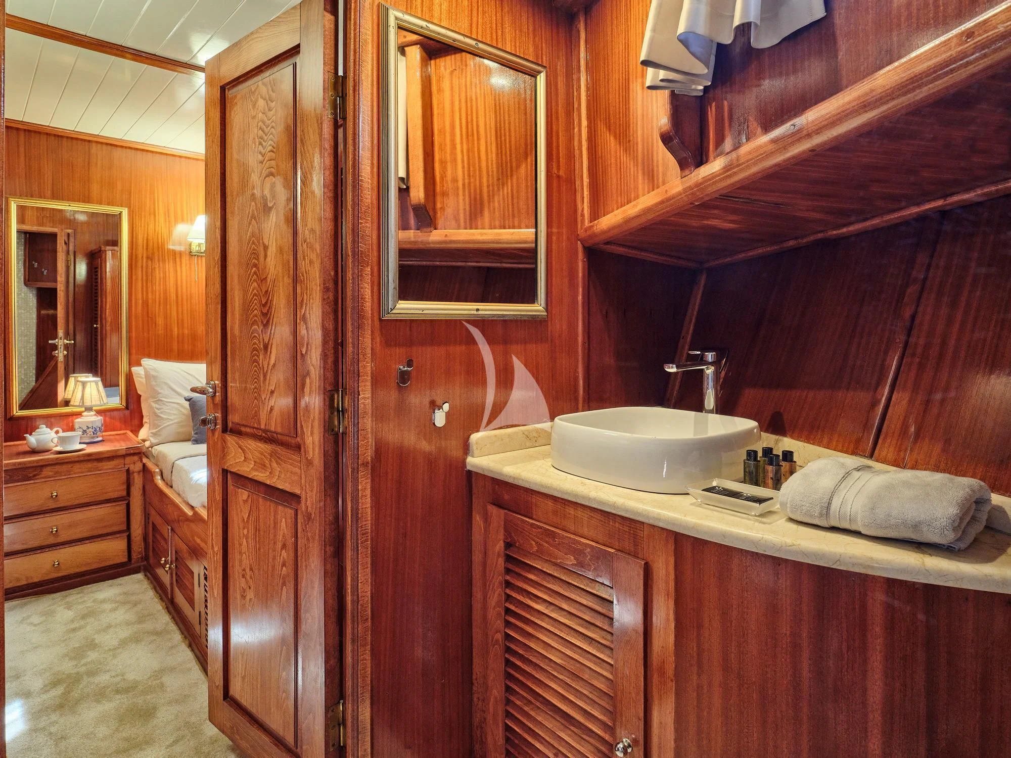 a bathroom with a sink and a mirror aboard MYRA Yacht for Sale