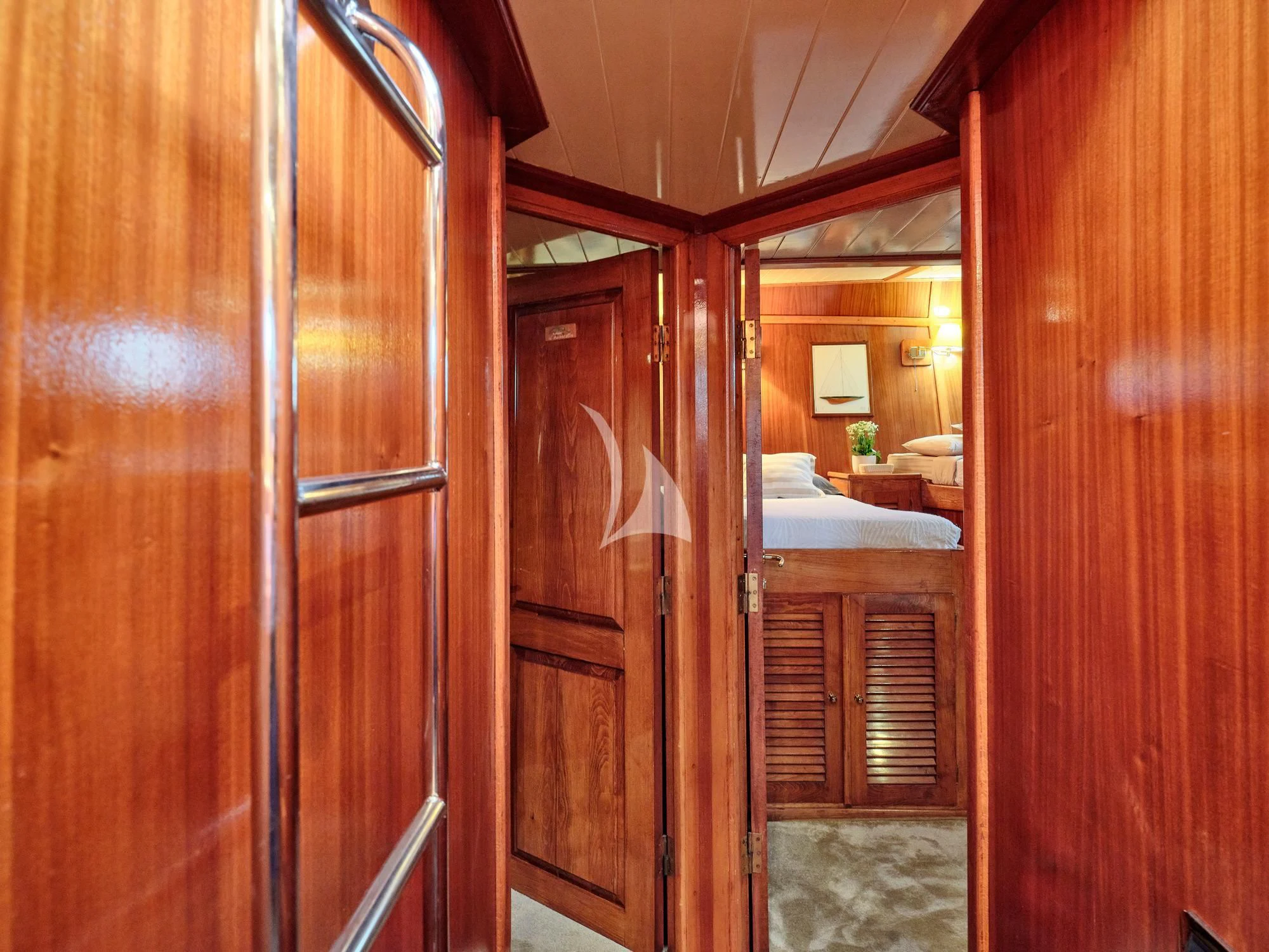 a room with wooden doors aboard MYRA Yacht for Sale