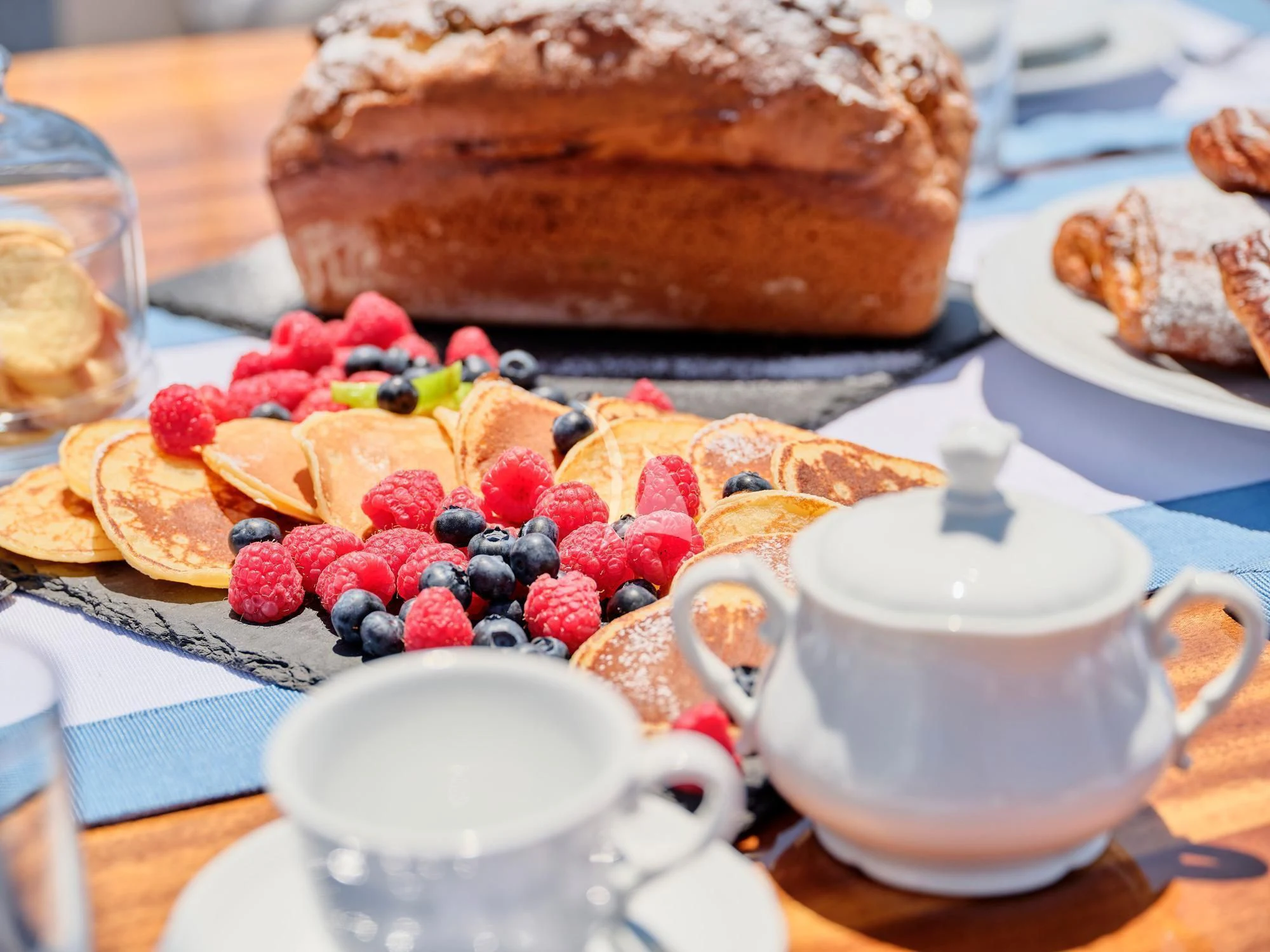 a cake sits on a table aboard MYRA Yacht for Sale