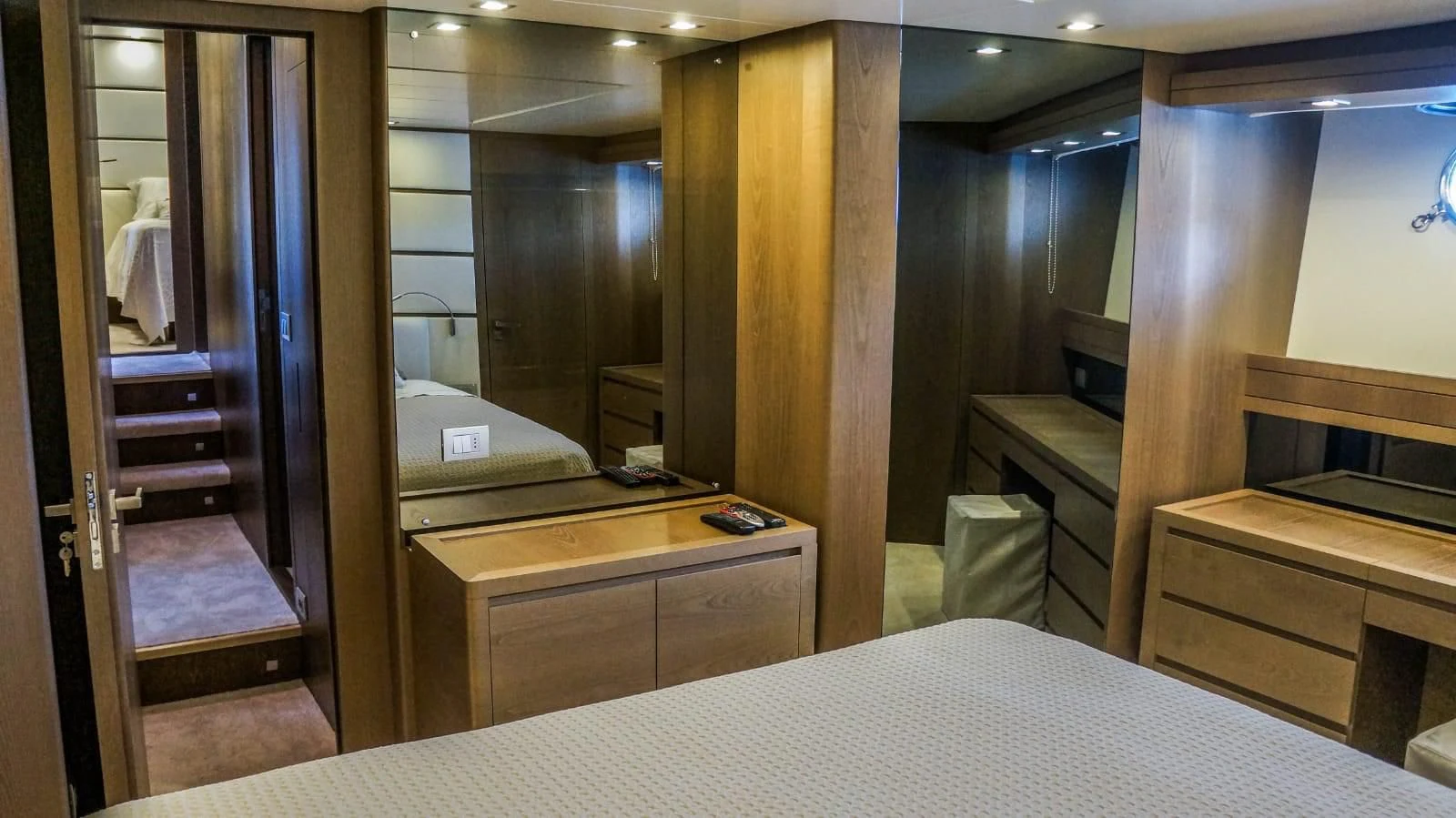 a room with a bed and a desk aboard KUUM Yacht for Sale