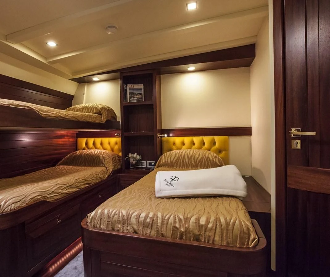 a room with a couple of beds aboard MARIA TERESA Yacht for Sale