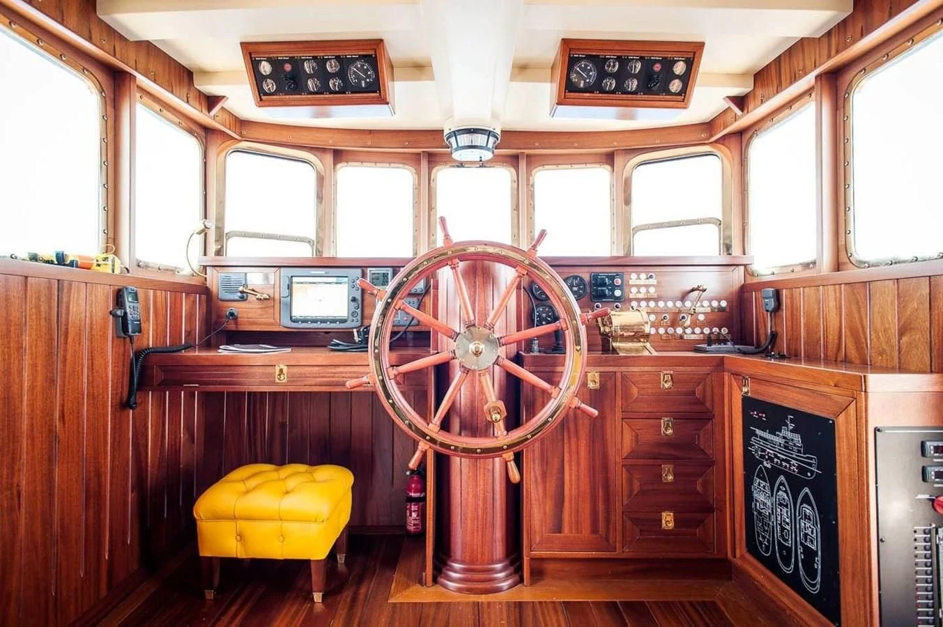 a wooden wheel in a wooden cabin aboard MARIA TERESA Yacht for Sale
