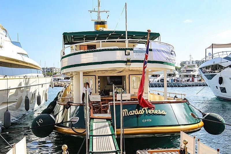 a boat docked at a pier aboard MARIA TERESA Yacht for Sale