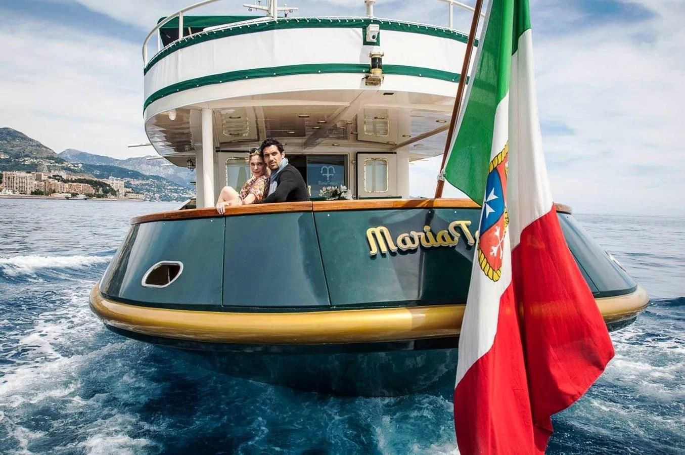 a couple of people on a sailboat aboard MARIA TERESA Yacht for Sale