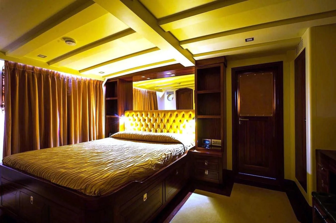 a bedroom with a bed and a closet aboard MARIA TERESA Yacht for Sale