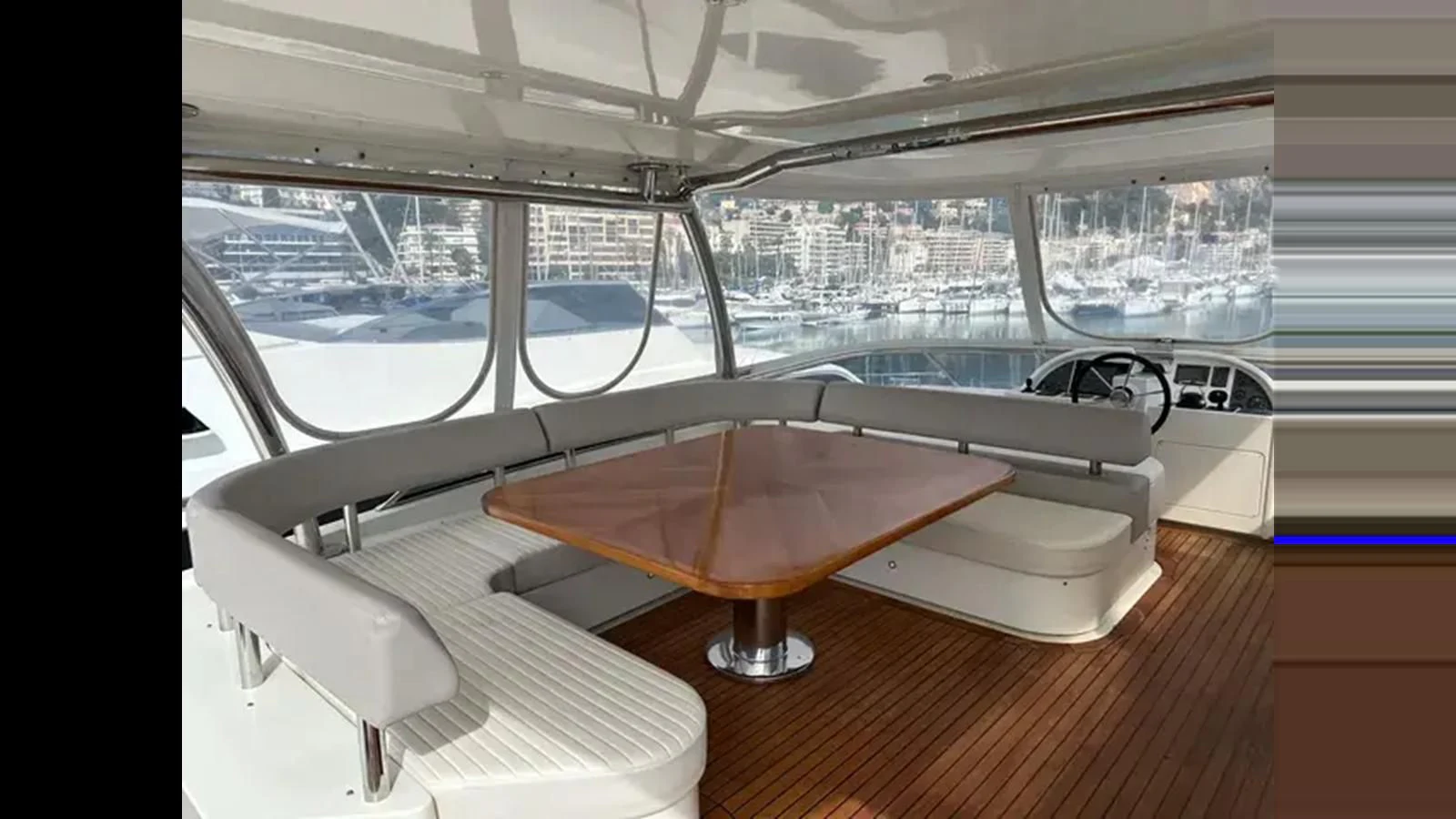 a room with a table and chairs aboard CHARISMA II Yacht for Sale