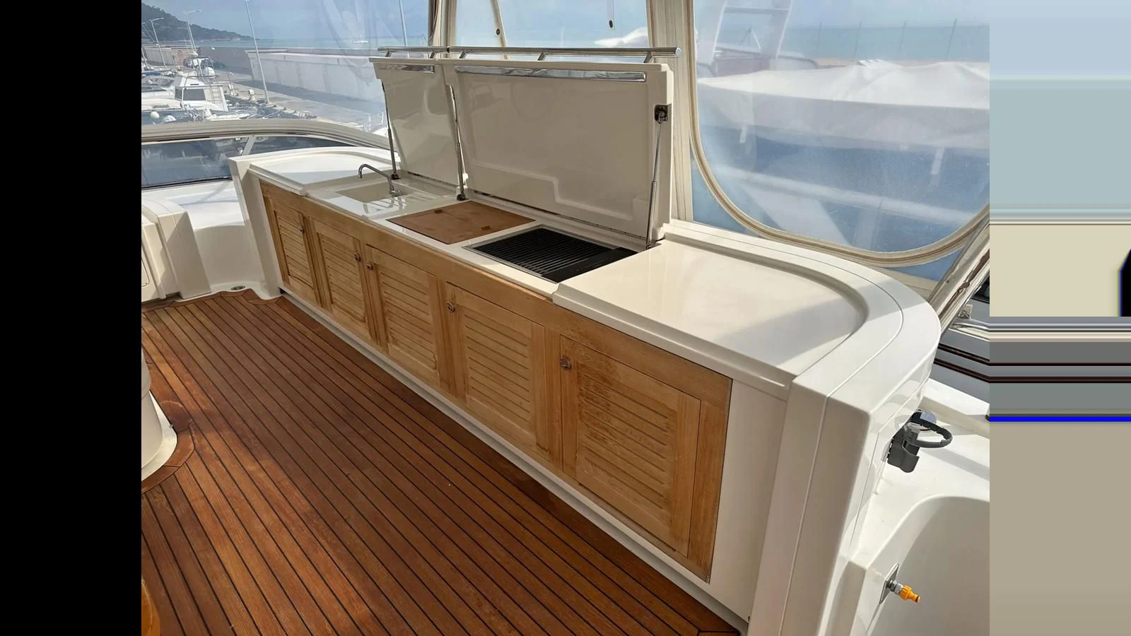 a kitchen with a large window aboard CHARISMA II Yacht for Sale