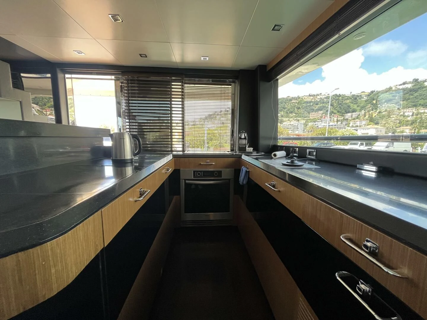 a kitchen with a large window aboard CHARISMA II Yacht for Sale