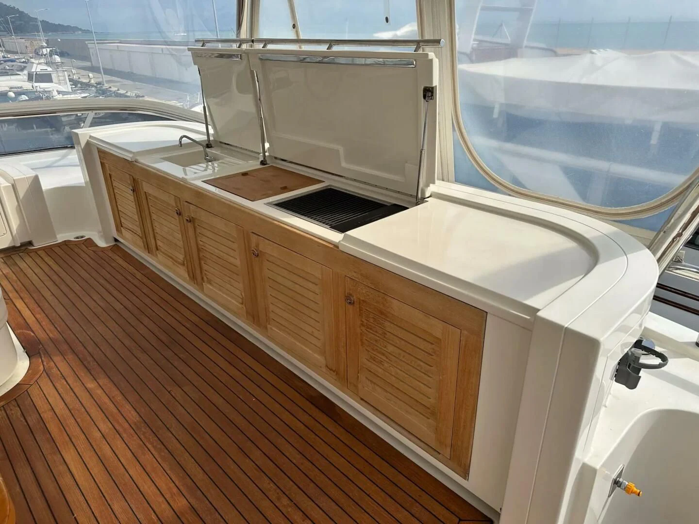 a kitchen with a large window aboard CHARISMA II Yacht for Sale