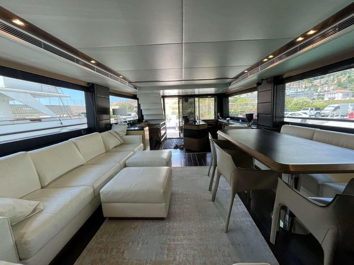 a room with a table and couches aboard CHARISMA II Yacht for Sale