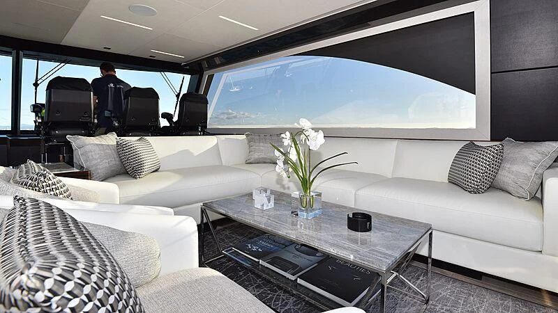a living room with a large blue and white window aboard MAKORO Yacht for Sale