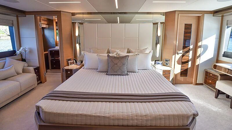 a large bed in a room aboard MAKORO Yacht for Sale
