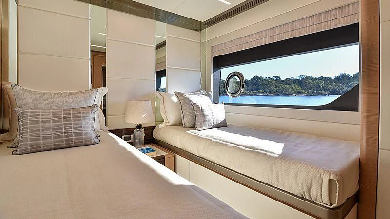 a room with two beds aboard MAKORO Yacht for Sale