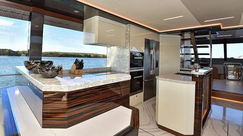 a modern kitchen with a large glass window aboard MAKORO Yacht for Sale