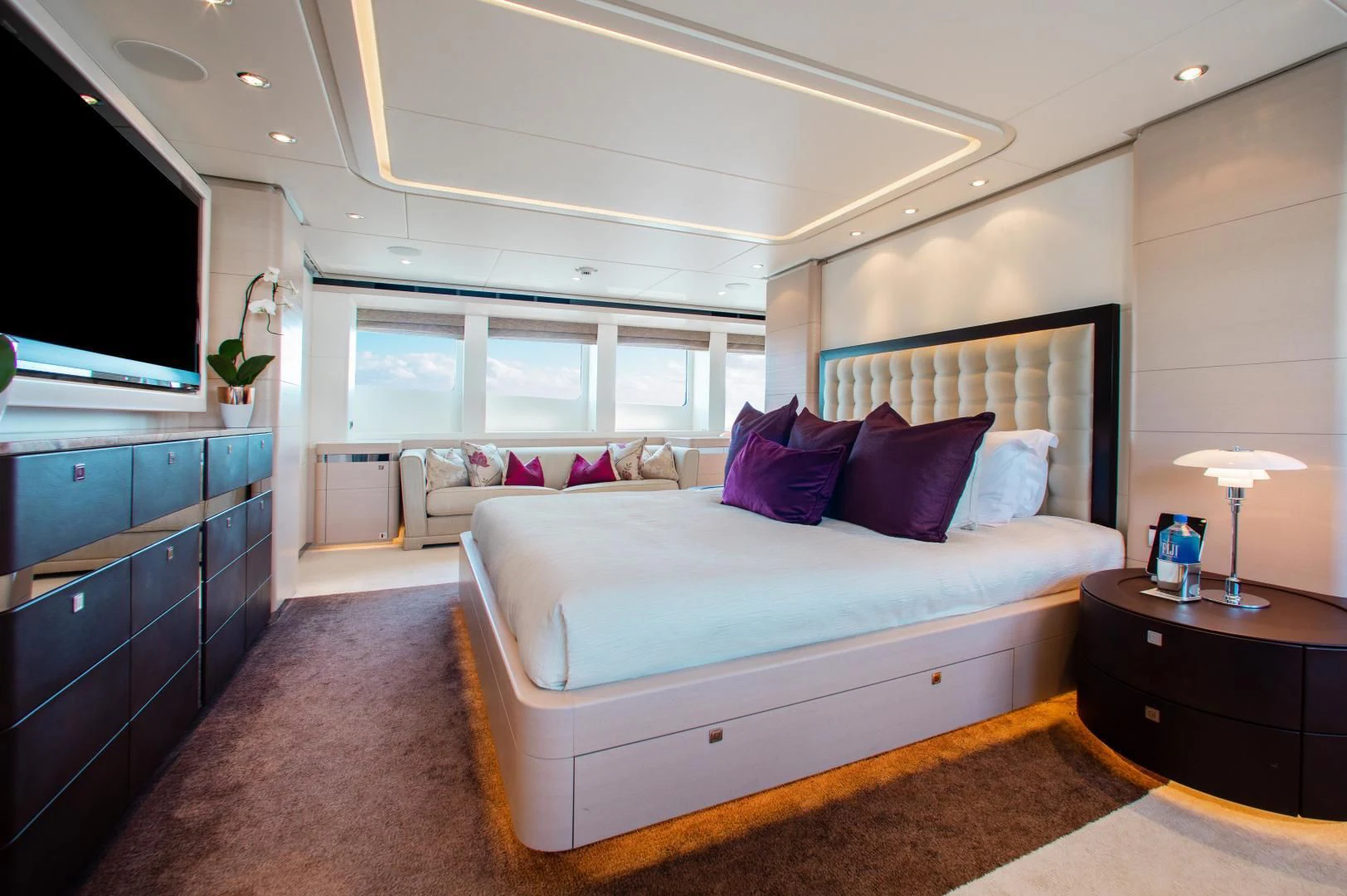 a bedroom with a large bed aboard LADY L Yacht for Charter