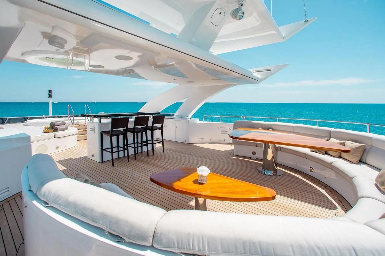 a room with a couch and a pool aboard LADY L Yacht for Charter