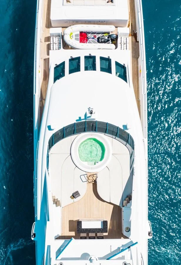 a rocket with a green circle on the front aboard LADY L Yacht for Charter
