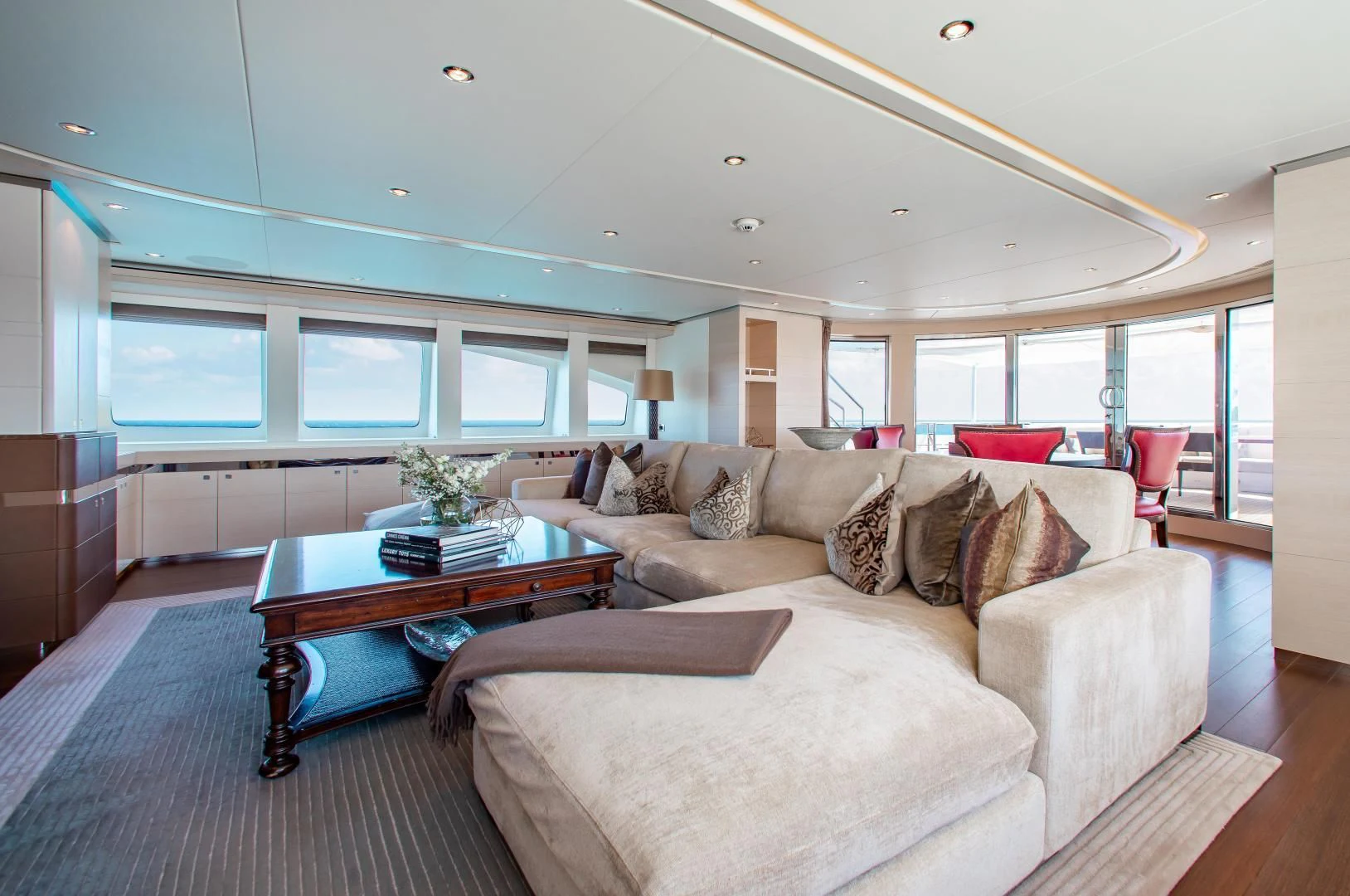 a living room with a couch and a coffee table aboard LADY L Yacht for Charter