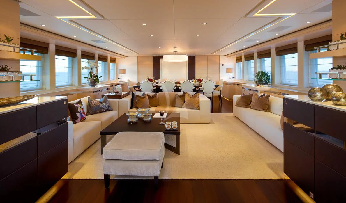 a living room with a couch and a coffee table aboard LADY L Yacht for Charter