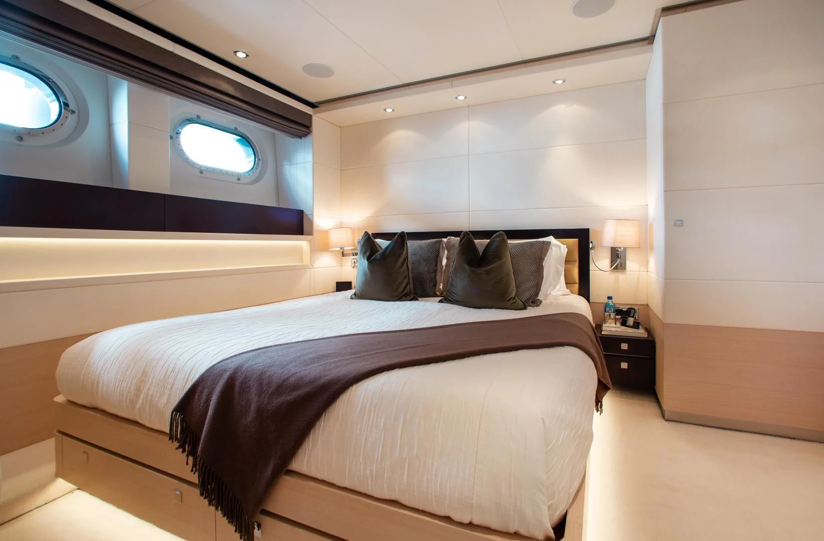 a bed in a room aboard LADY L Yacht for Charter