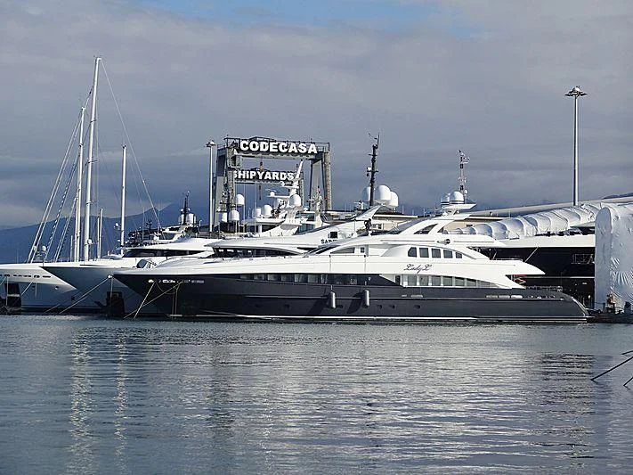 a large white boat sits in the water aboard LADY L Yacht for Charter