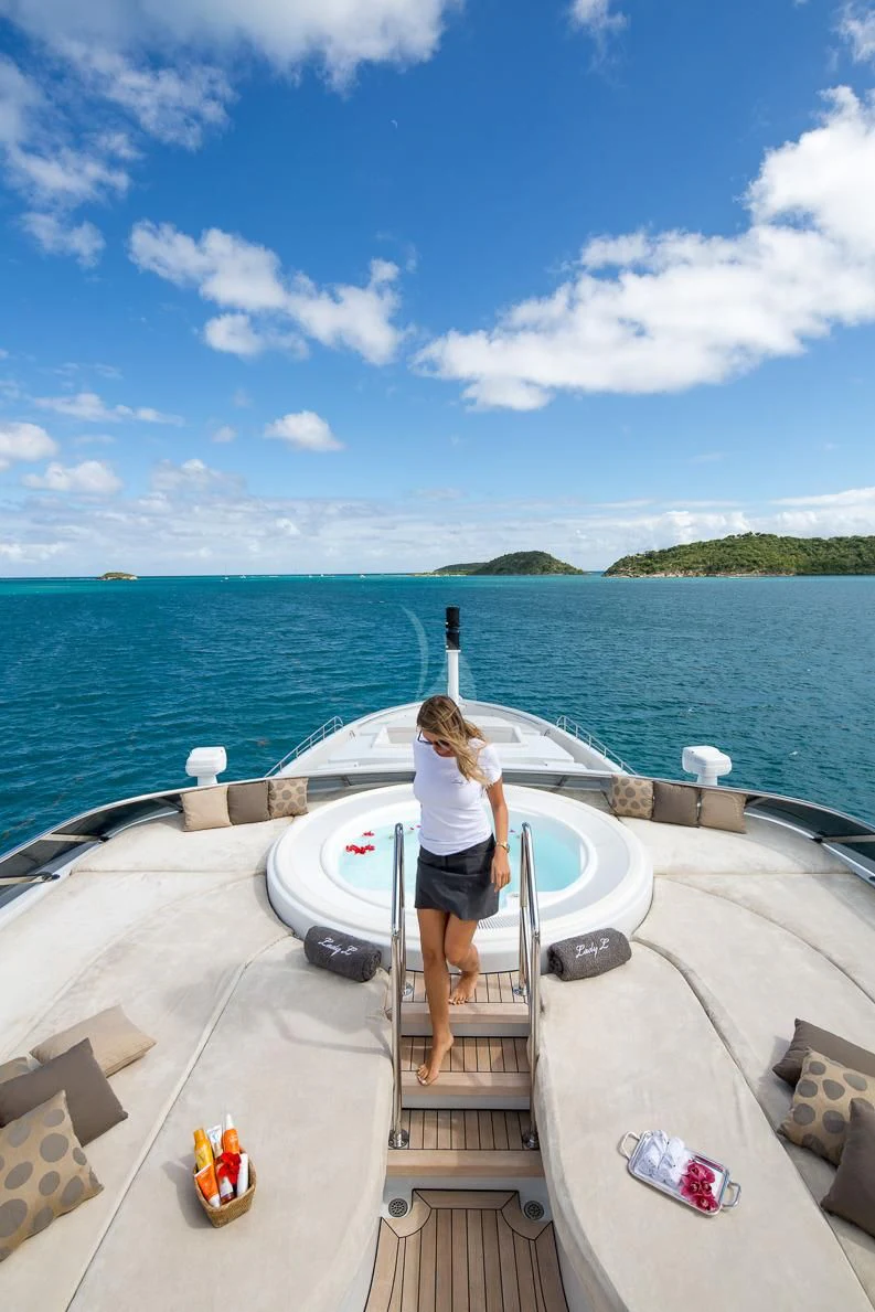 a person standing on a boat aboard LADY L Yacht for Charter