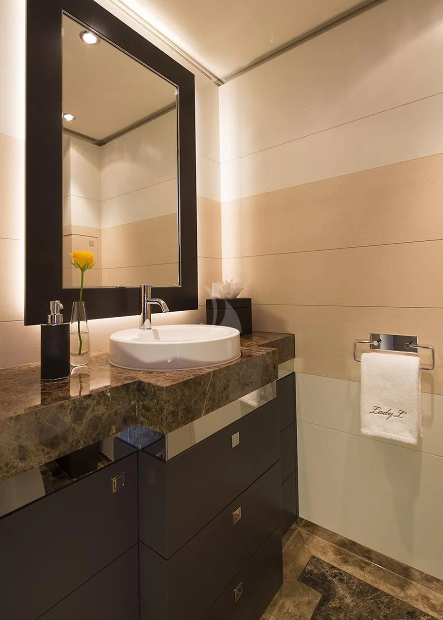 a bathroom with a large mirror aboard LADY L Yacht for Charter