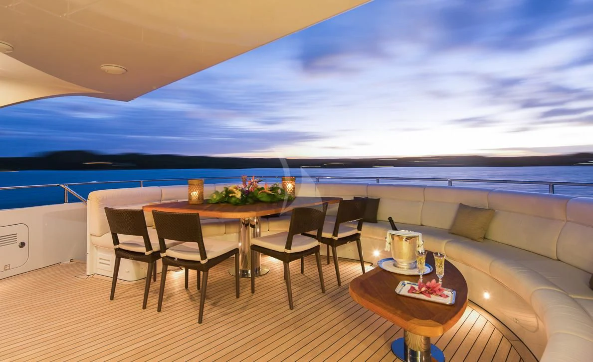 a room with a table and chairs aboard LADY L Yacht for Charter