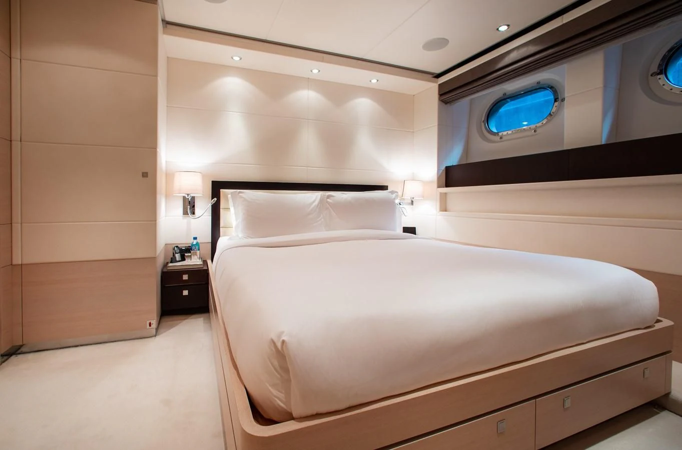 a bed in a room aboard LADY L Yacht for Charter