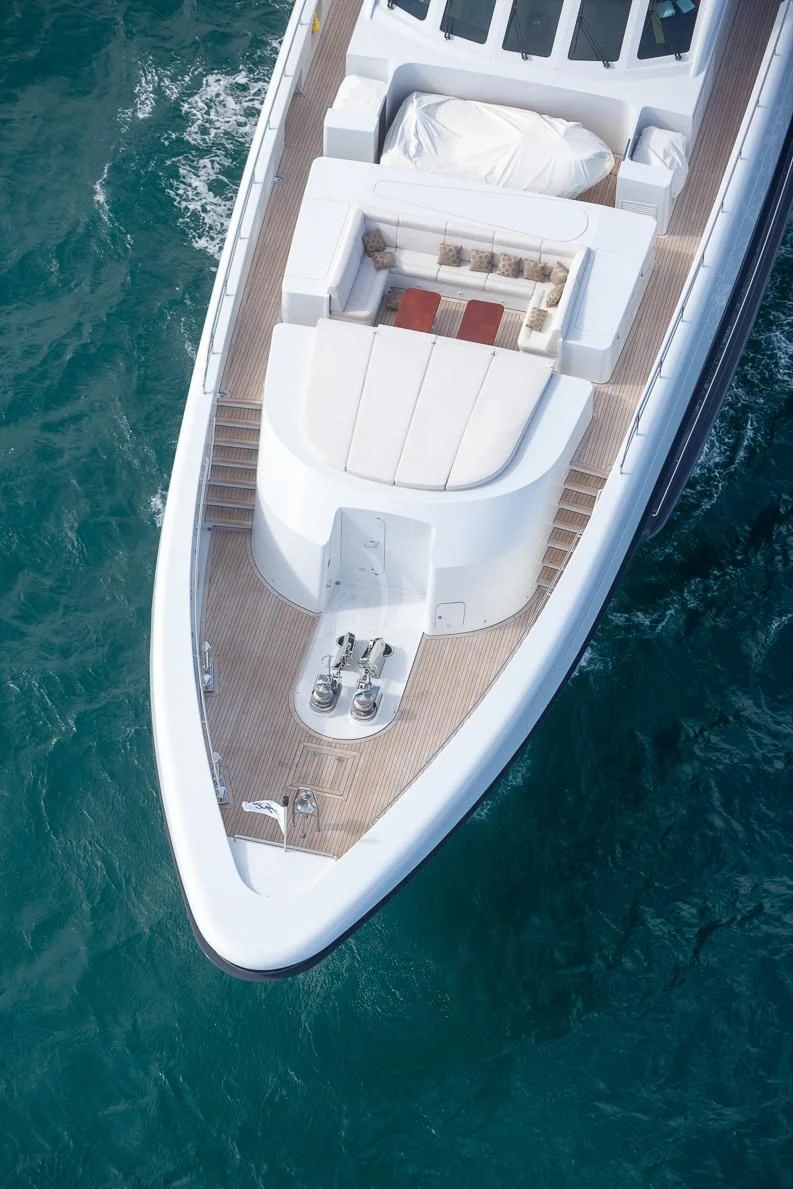 a white boat on a body of water aboard LADY L Yacht for Charter