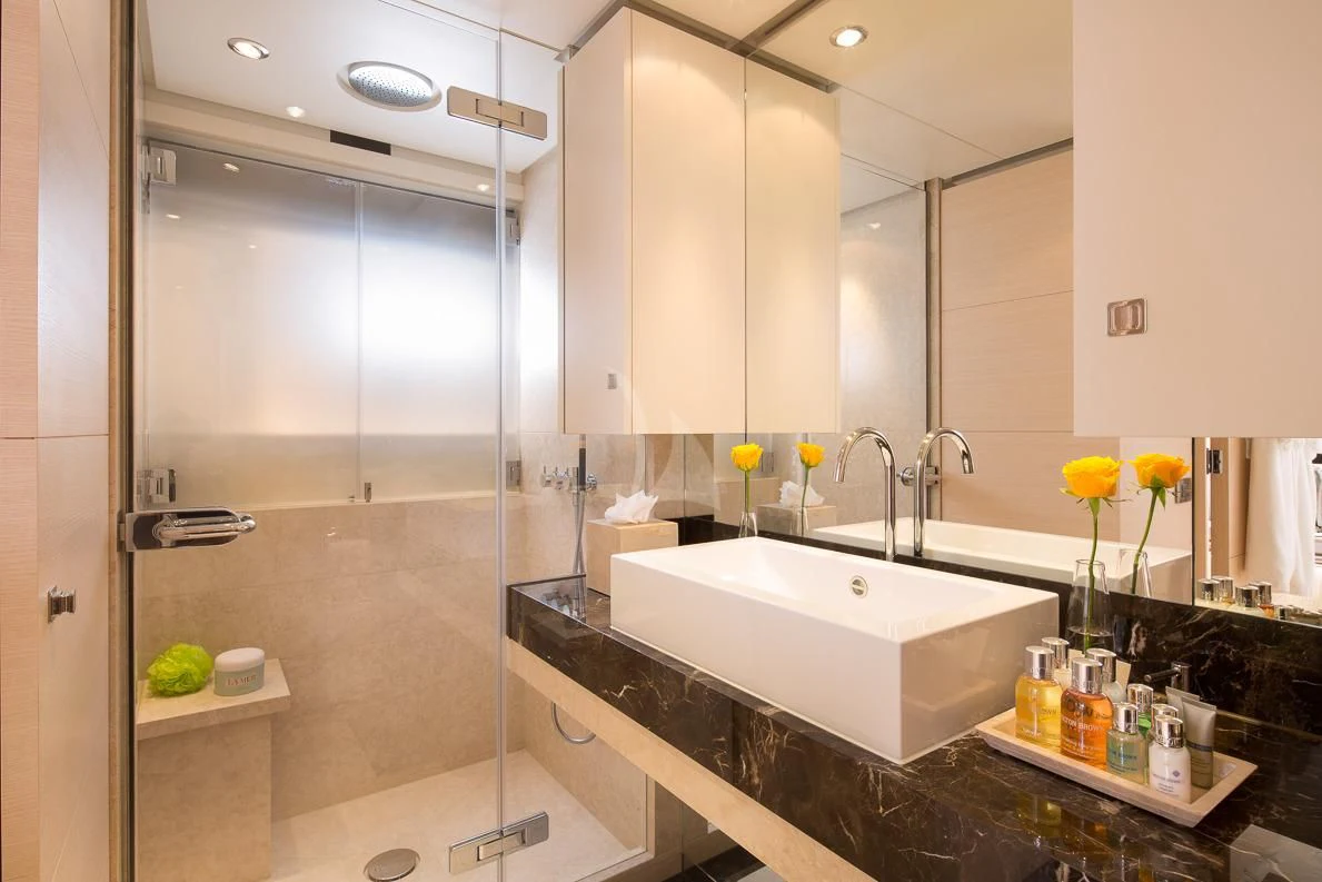 a bathroom with a large bathtub aboard LADY L Yacht for Charter