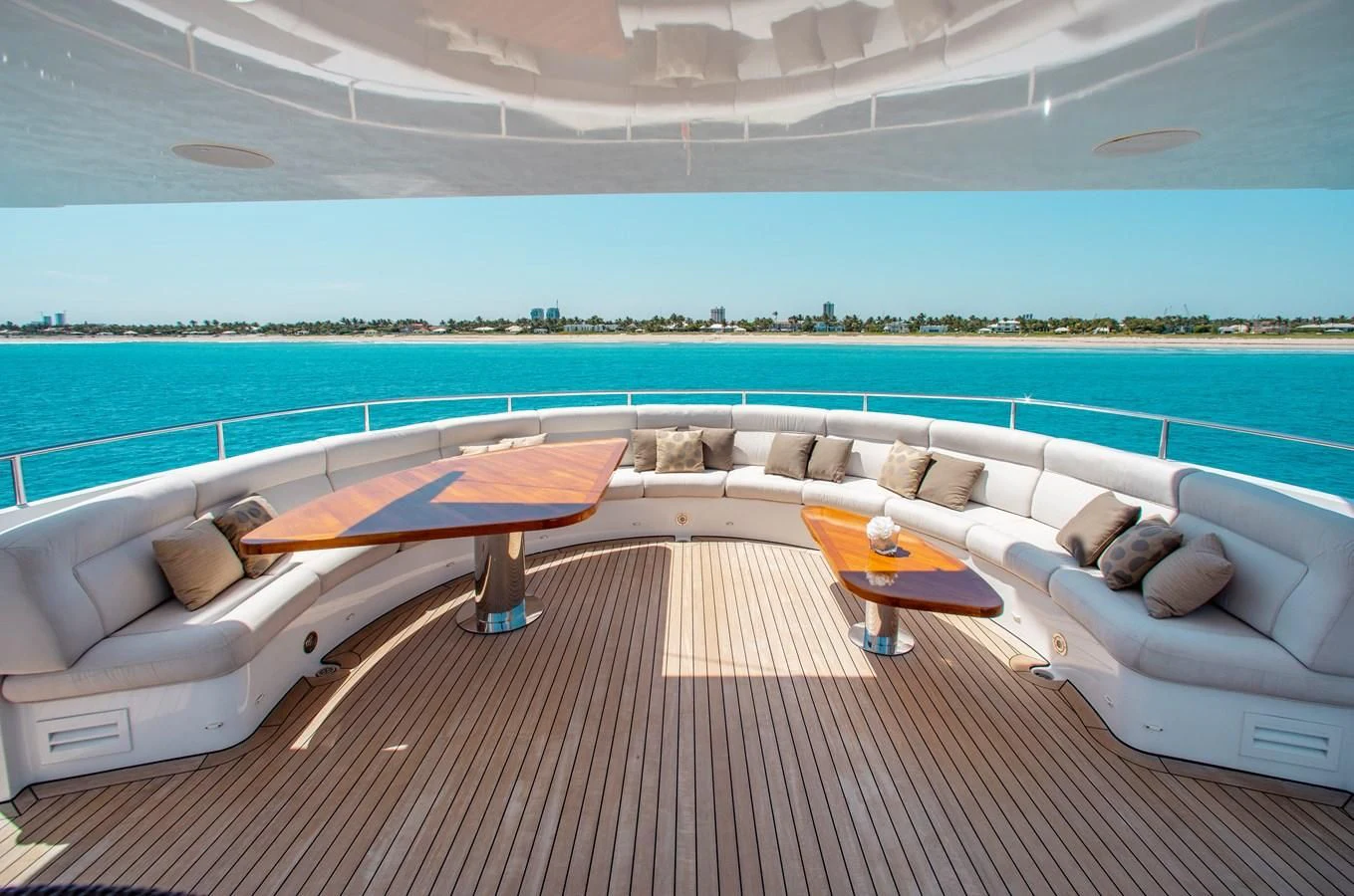 a lounge area with a couch and a pool aboard LADY L Yacht for Charter