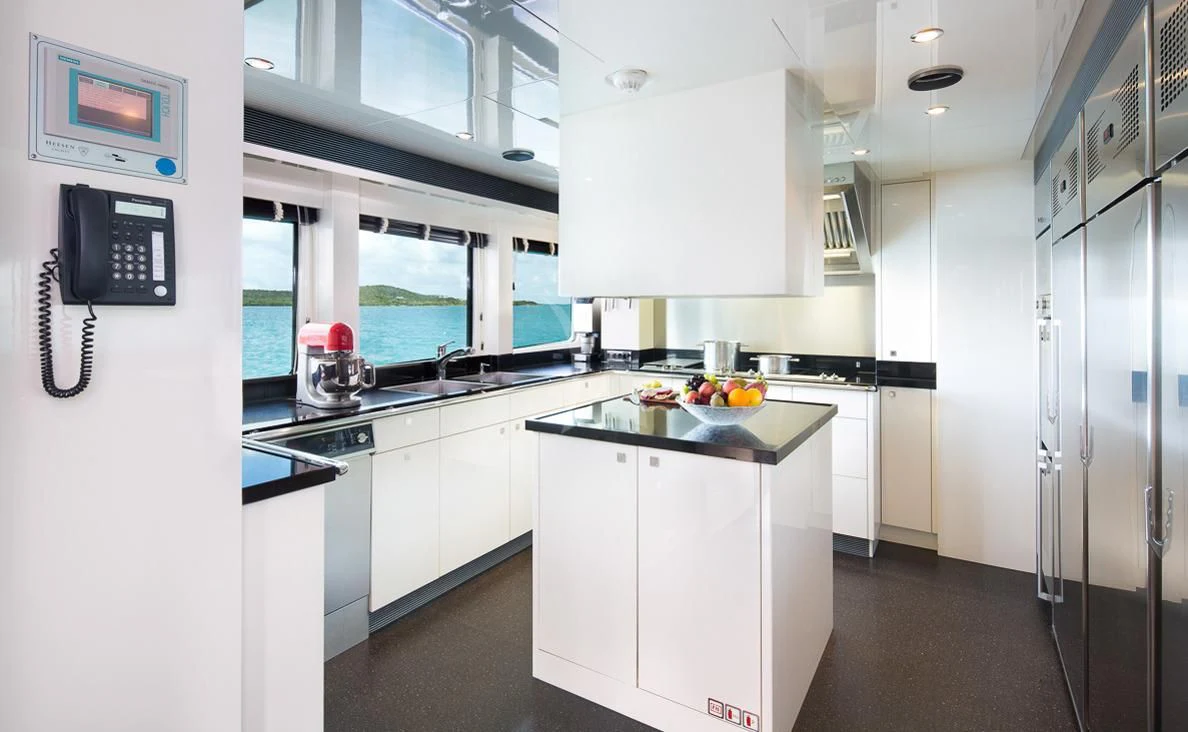 a kitchen with white cabinets aboard LADY L Yacht for Charter
