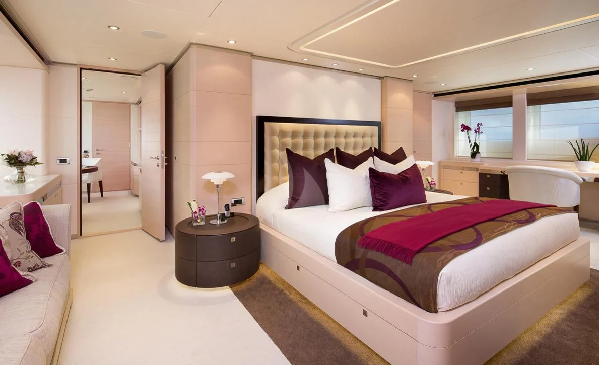 a large bedroom with a bed aboard LADY L Yacht for Charter