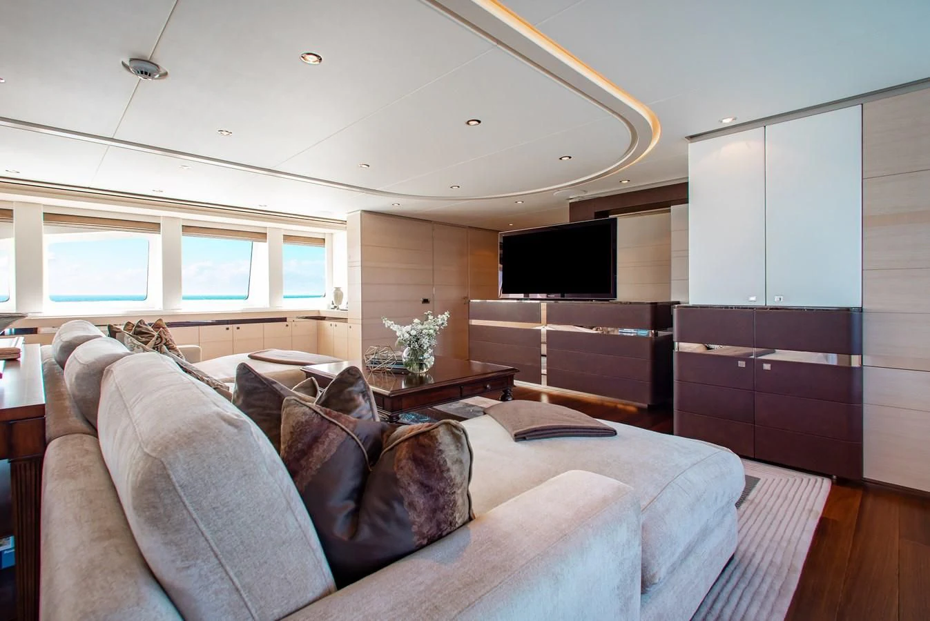 a living room with a couch aboard LADY L Yacht for Charter