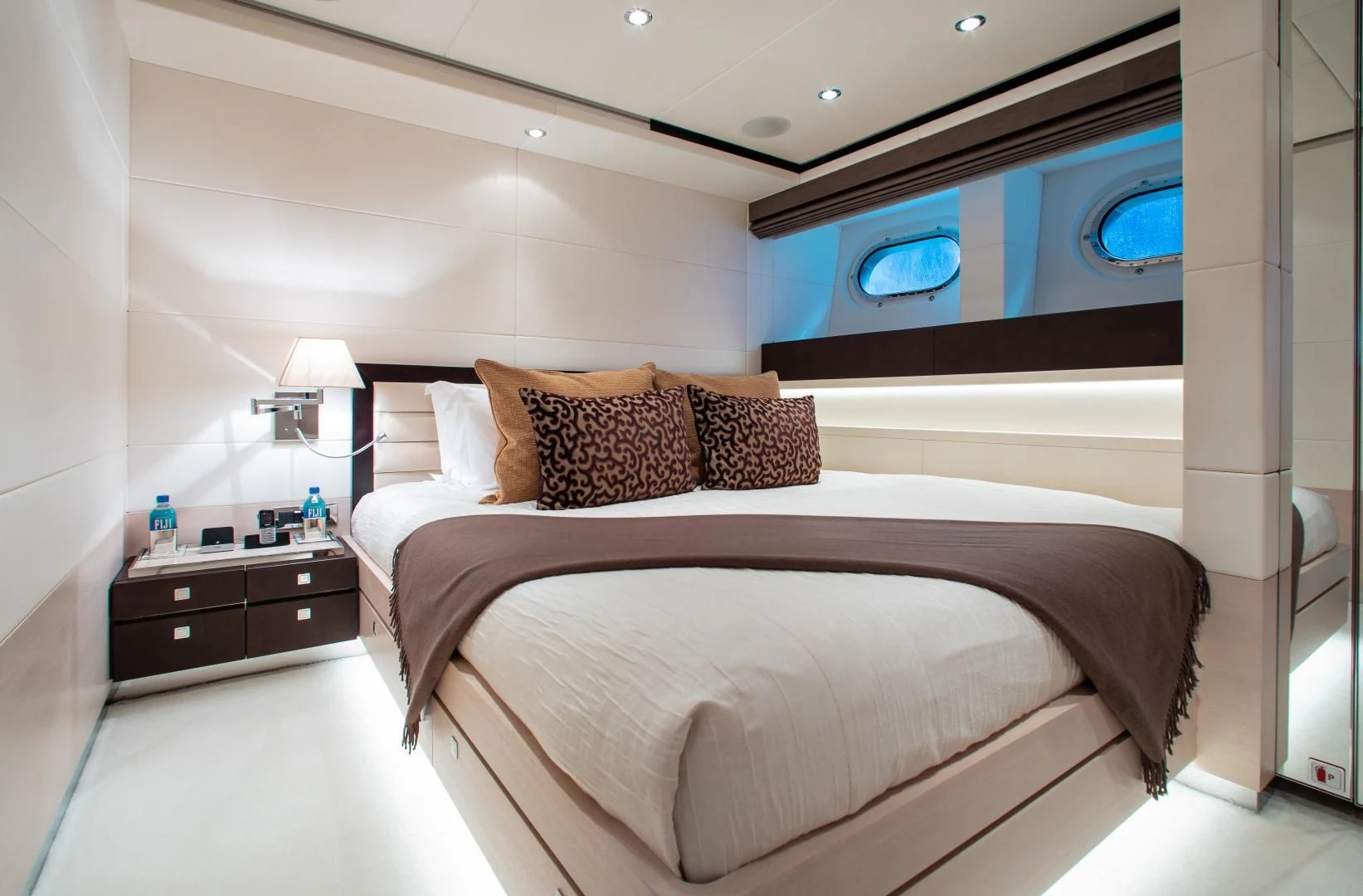 a bed in a room aboard LADY L Yacht for Charter