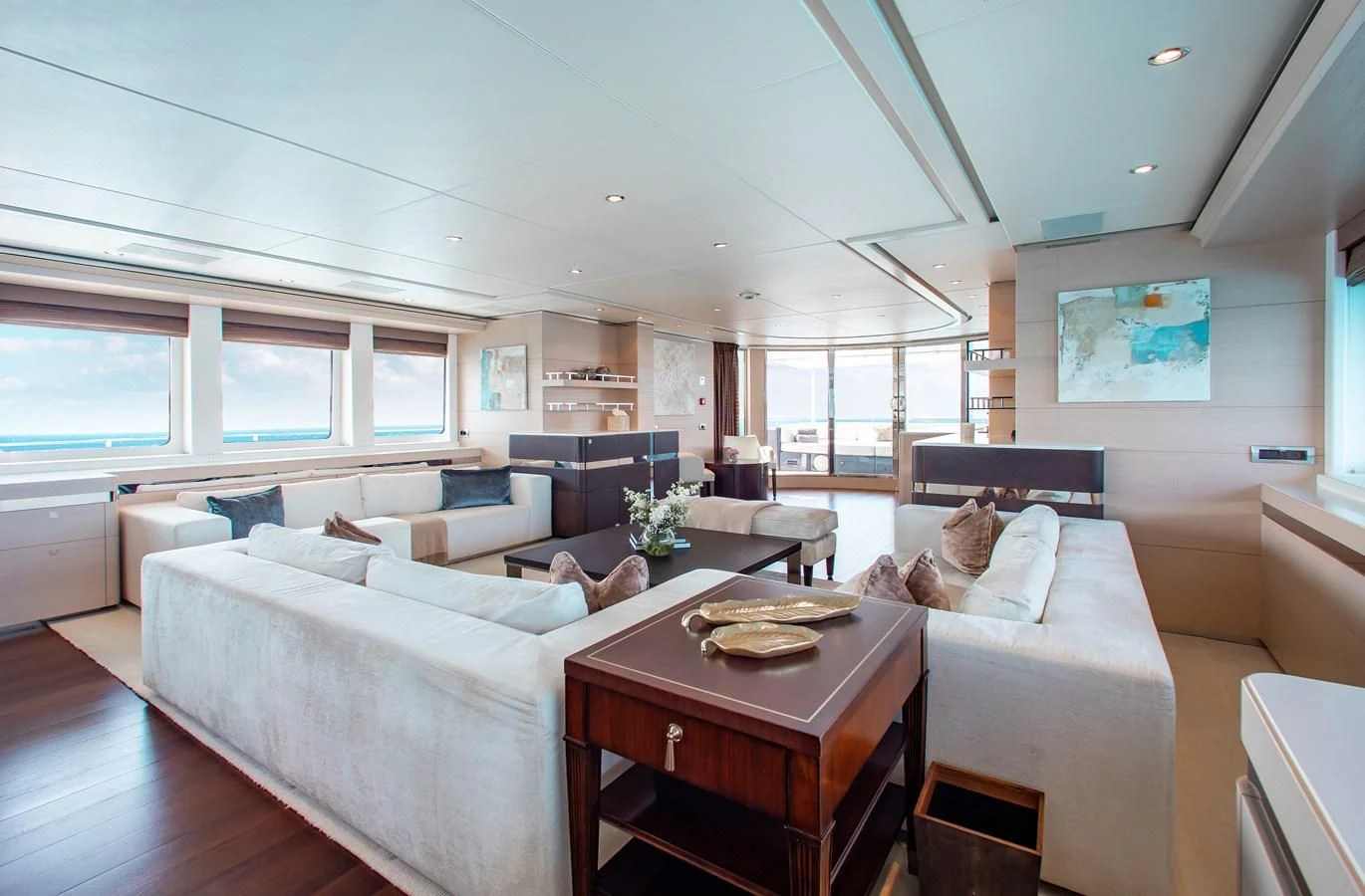 a living room with a couch and a coffee table aboard LADY L Yacht for Charter