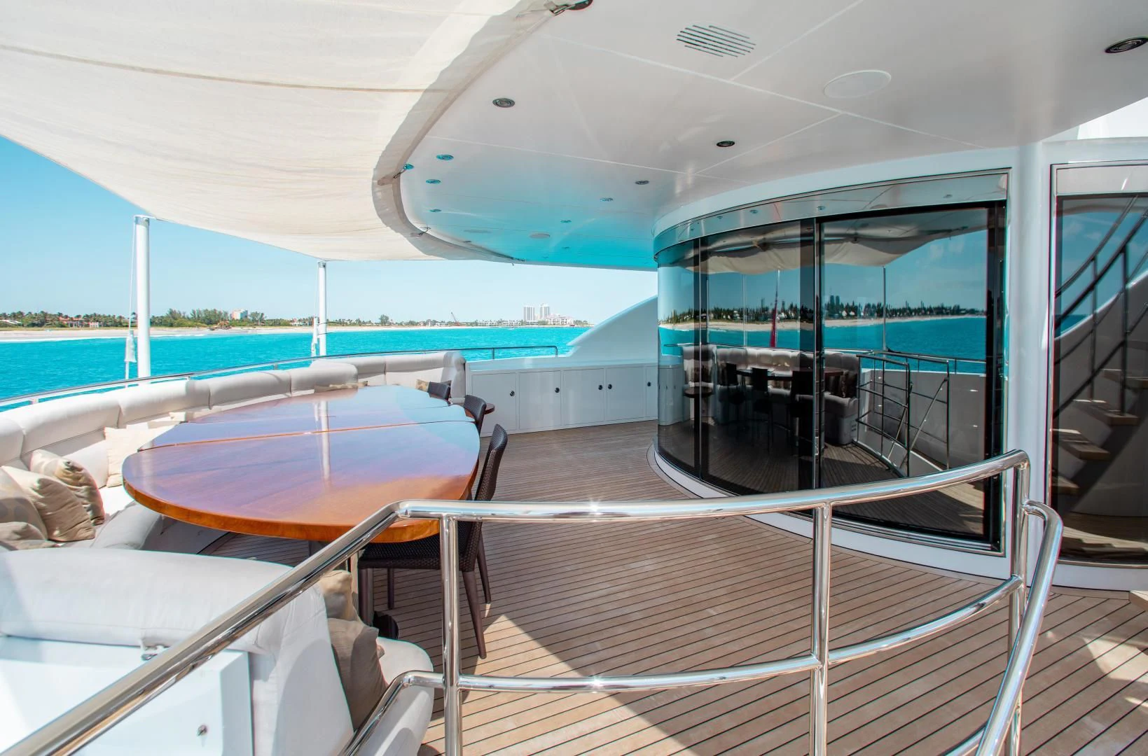a boat with a table and chairs aboard LADY L Yacht for Charter