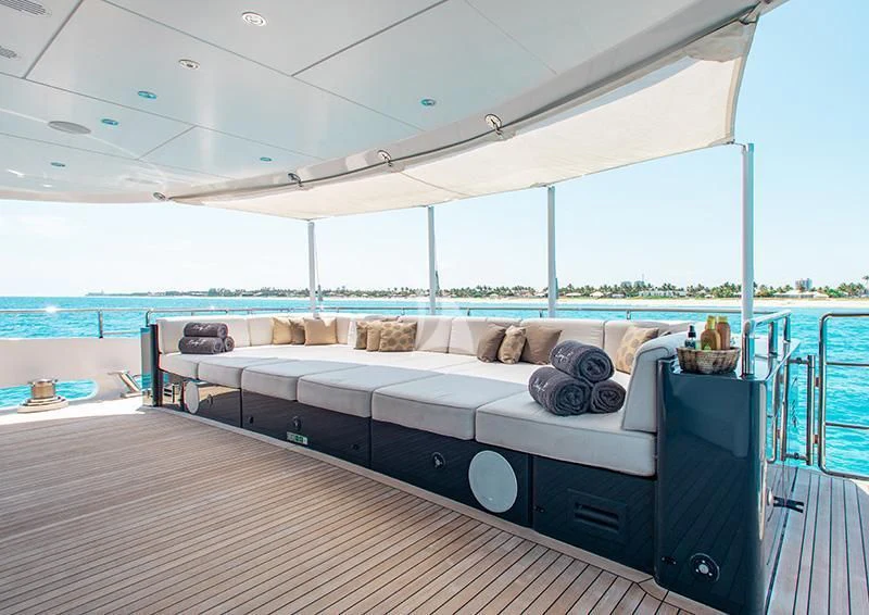 a bed on a deck aboard LADY L Yacht for Charter