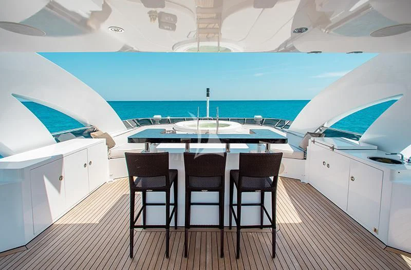a room with a table and chairs aboard LADY L Yacht for Charter