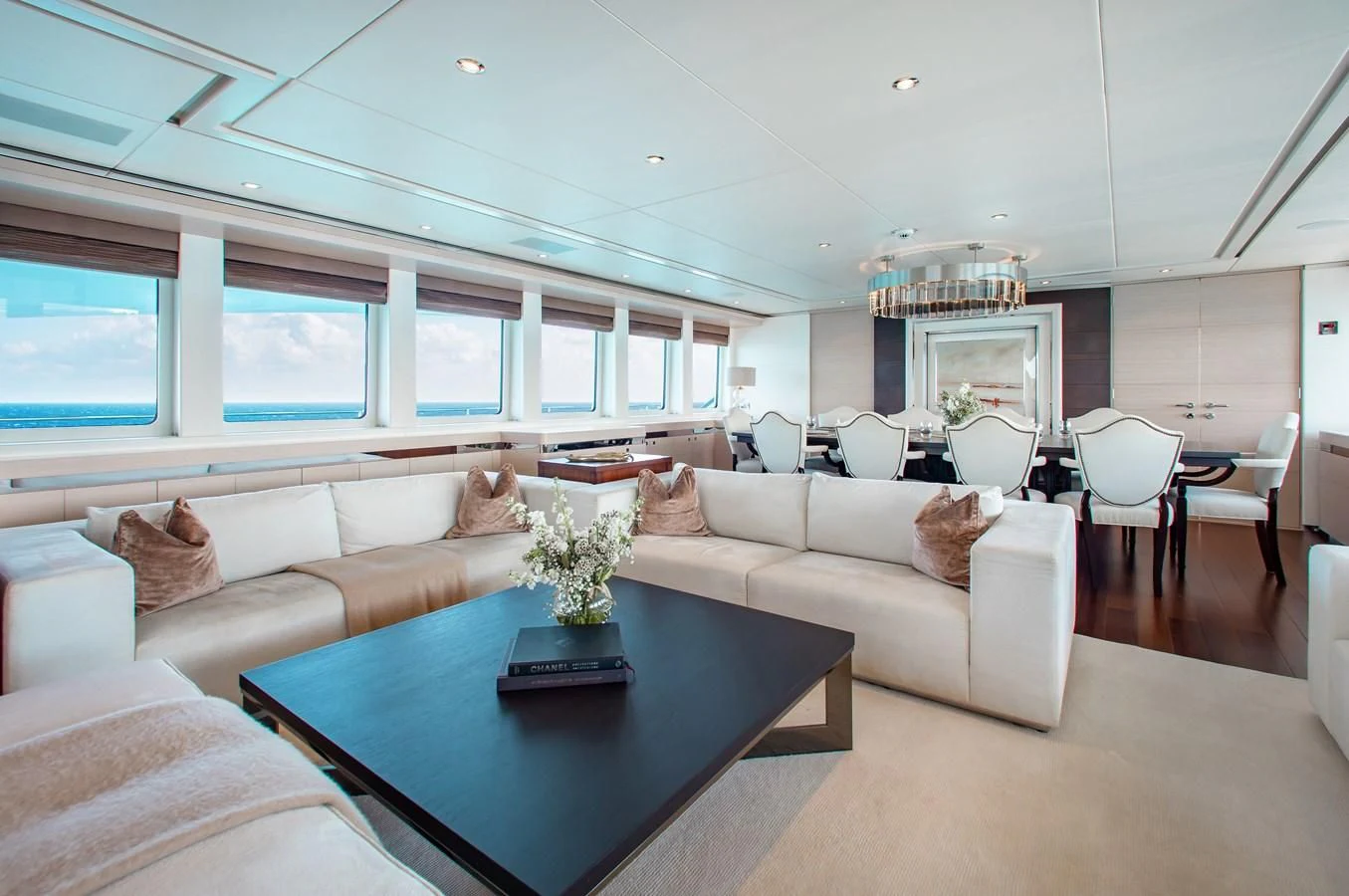 a living room with a couch and a table aboard LADY L Yacht for Charter