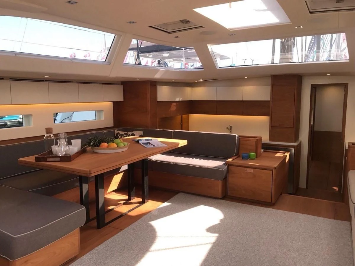 a room with a couch and a table aboard ONE SHOT Yacht for Sale