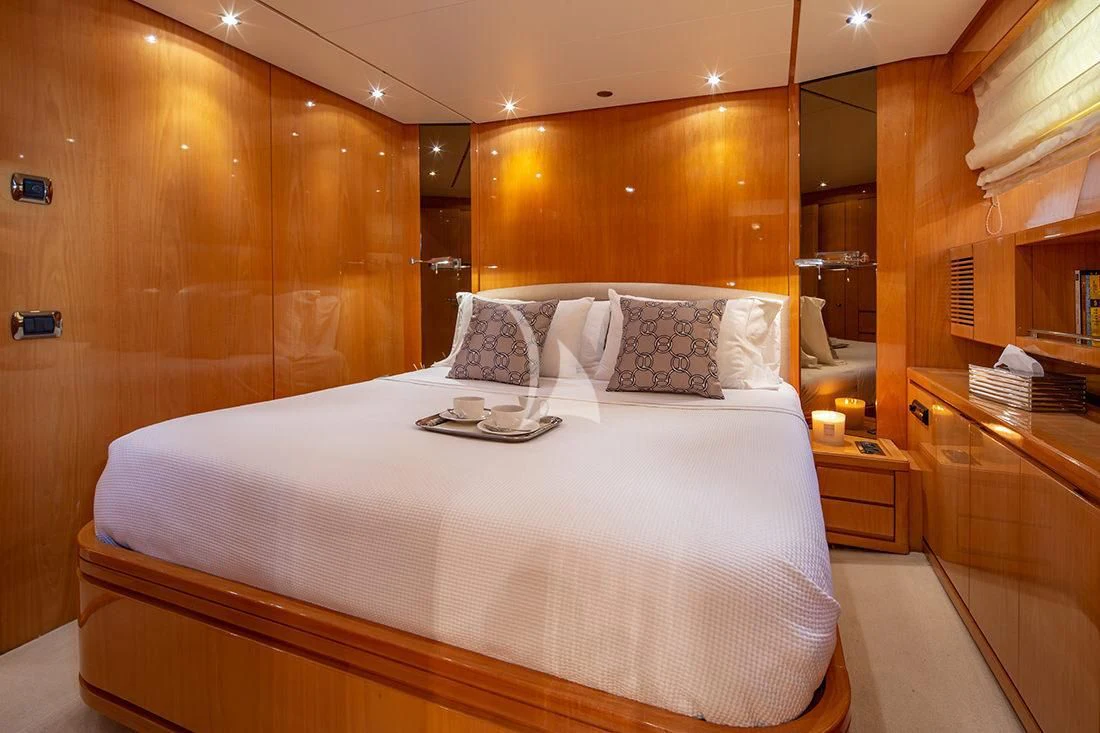 a bed with a white sheet aboard THE BIRD Yacht for Charter