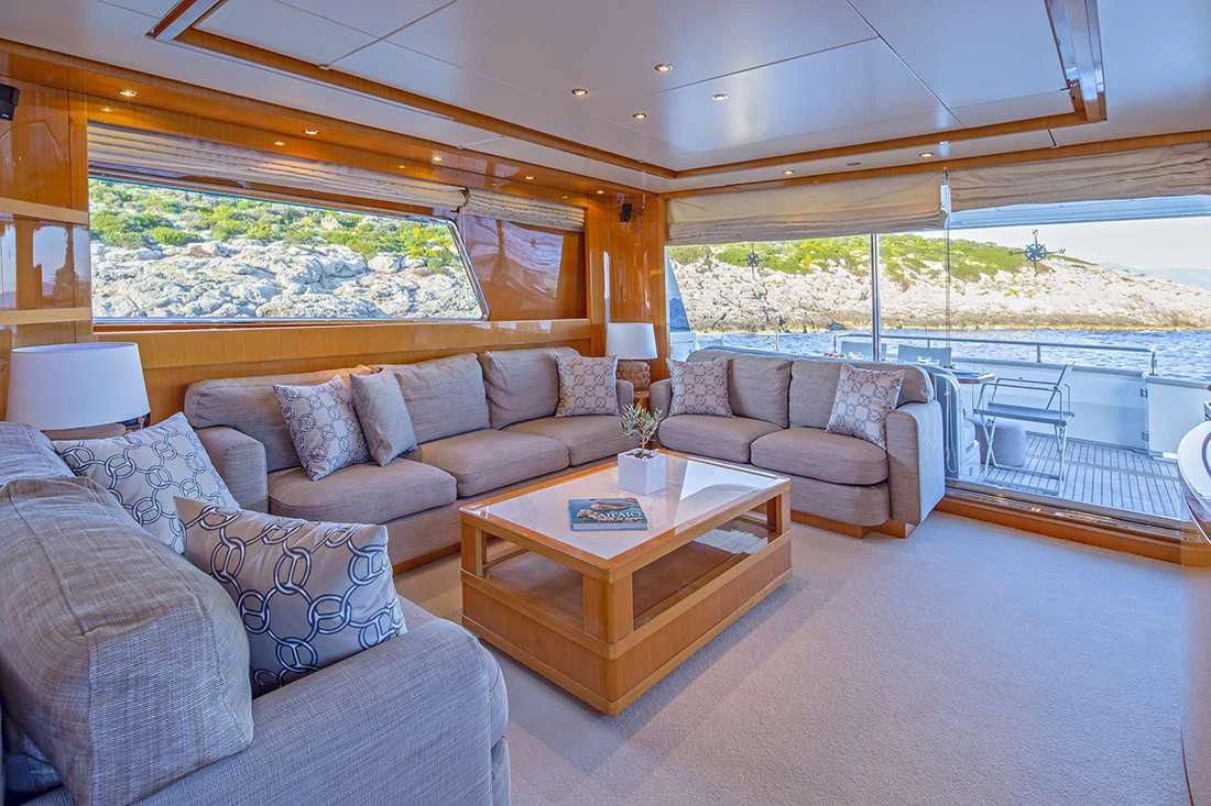 a living room with a large window aboard THE BIRD Yacht for Charter